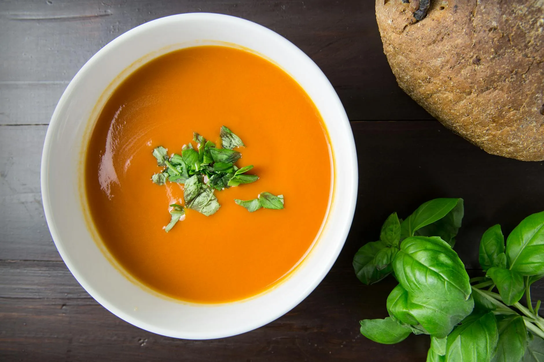 tomato soup in white ceramic bowl