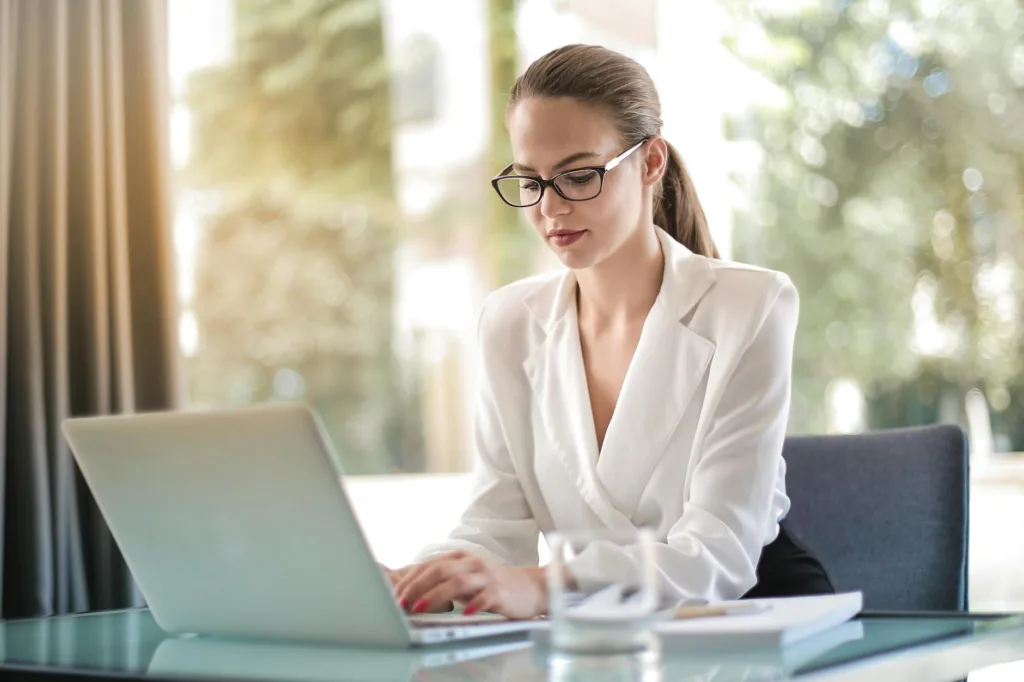 concentrated female entrepreneur typing on laptop in workplace. CareerBuilder 