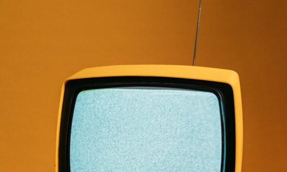 classic yellow tv with blank screen