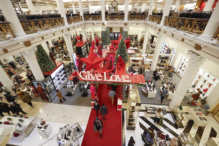 A big department store decked out for the holiday season in red and white colors.