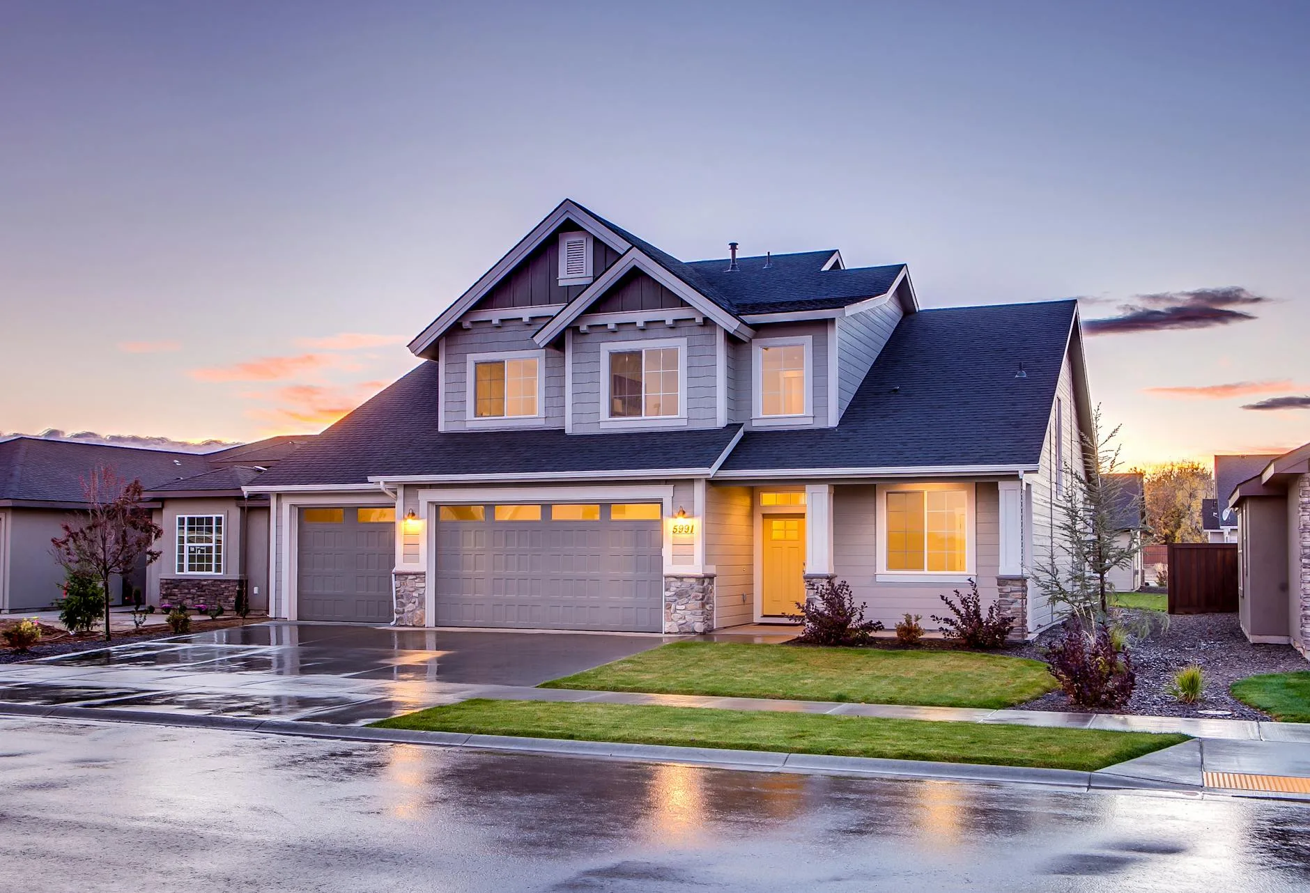 blue and gray concrete house with an attic during twilight. Homes