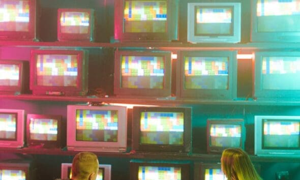a man and woman with prosthetic hand sitting on the floor