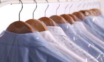 hangers with shirts in dry cleaning plastic bags o 2026 03 27 00 51 00 utc 1