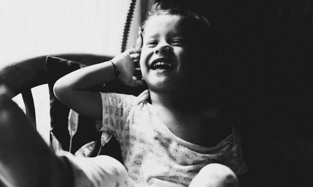 black and white picture of a smiling baby