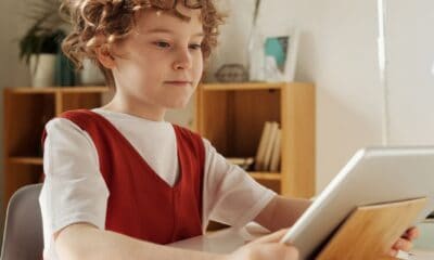a boy studying using an ipad