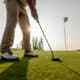 man prepares golf putt on green field 2026 03 16 22 56 01 utc